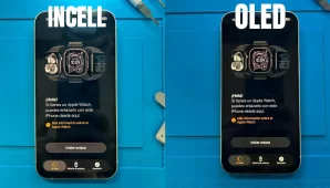 Dos iPhone en mesa de reparación comparando calidad de imagen: pantalla LCD InCell con negros grisáceos a la izquierda y pantalla OLED con negros profundos a la derecha.